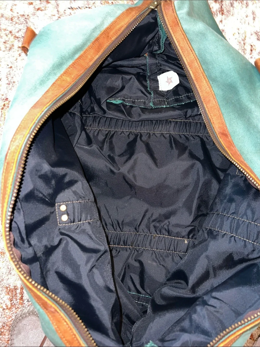 Vintage green duffle bag with leather handles